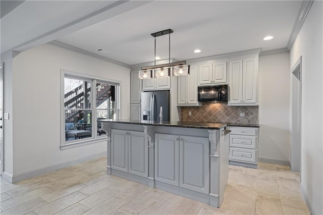 2260 Wood Falls Dr, Cumming, GA 30041 - kitchen with crown molding, stainless steel fridge with ice dispenser, black microwave, baseboards, and tasteful backsplash