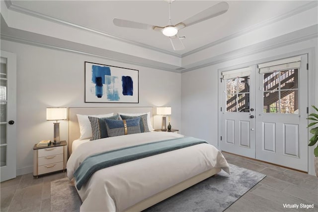 2260 Wood Falls Dr, Cumming, GA 30041 - bedroom featuring ornamental molding, a ceiling fan, and a tray ceiling