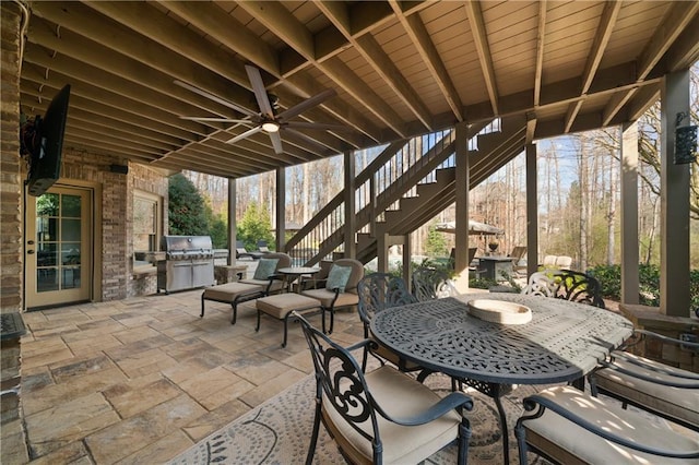 2260 Wood Falls Dr, Cumming, GA 30041 - view of patio featuring stairs, ceiling fan, exterior kitchen, and outdoor dining space