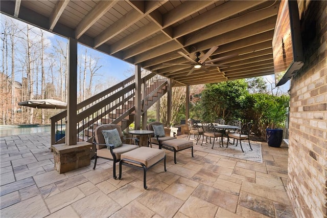 2260 Wood Falls Dr, Cumming, GA 30041 - view of patio featuring outdoor dining area, stairs, and an outdoor pool