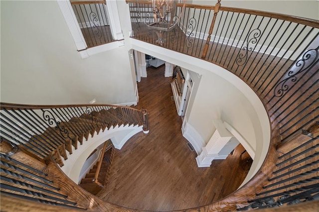 2260 Wood Falls Dr, Cumming, GA 30041 - stairs featuring baseboards, a towering ceiling, and wood finished floors