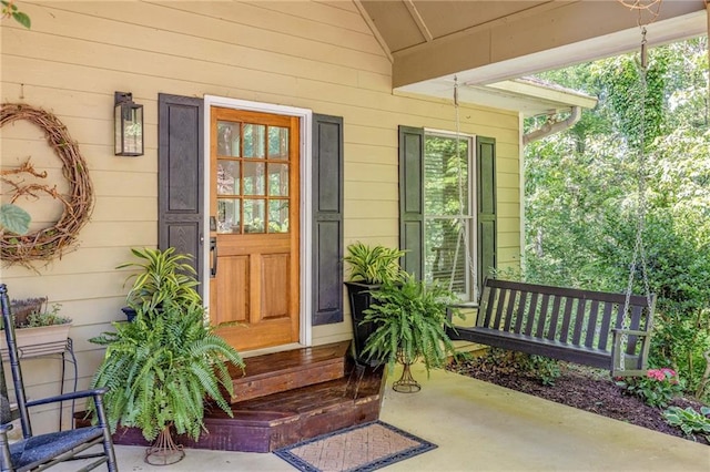 property entrance with covered porch