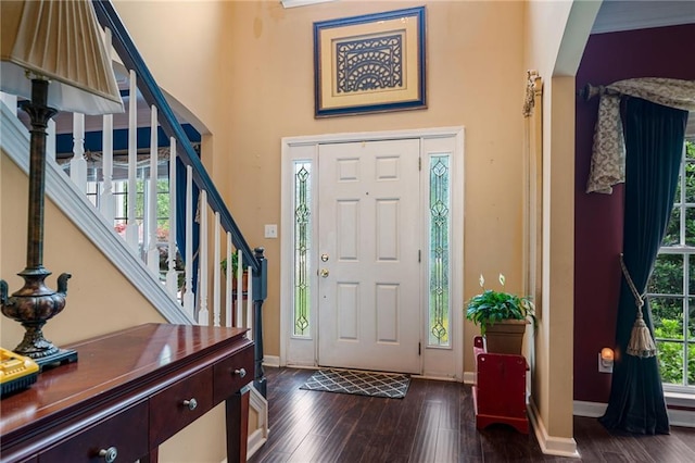 1360 Woodvine Way, Alpharetta, GA 30005 - entrance foyer featuring dark wood-style flooring, stairs, baseboards, and a towering ceiling