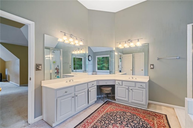 1360 Woodvine Way, Alpharetta, GA 30005 - full bathroom featuring double vanity, an enclosed shower, baseboards, and a towering ceiling