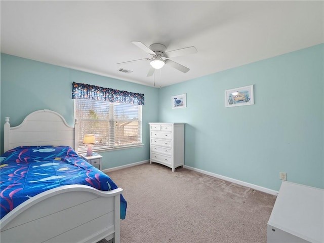 bedroom with carpet floors, visible vents, baseboards, and a ceiling fan