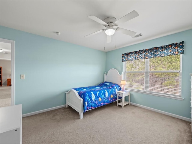 bedroom featuring baseboards, visible vents, and carpet flooring