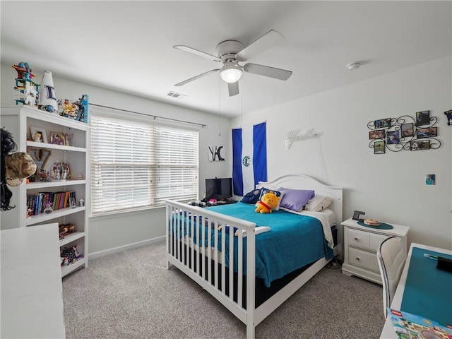 bedroom with a ceiling fan, baseboards, visible vents, and carpet flooring