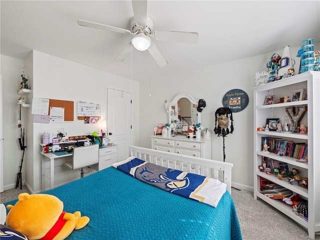 carpeted bedroom featuring ceiling fan and baseboards