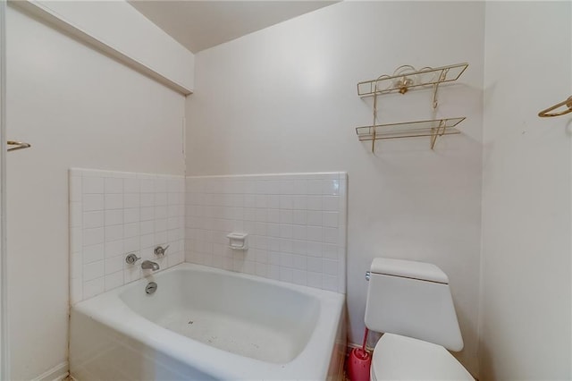 bathroom featuring toilet and a bathing tub