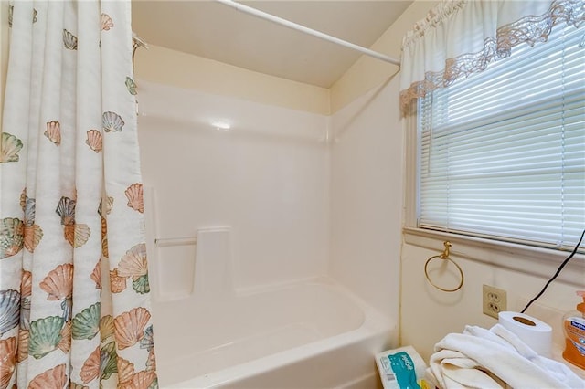 bathroom featuring shower / bath combination with curtain