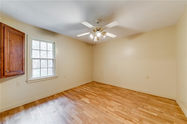 spare room with ceiling fan and light hardwood / wood-style flooring