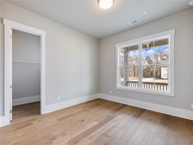 spare room with light hardwood / wood-style floors