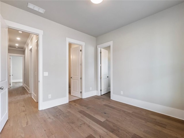 unfurnished bedroom with light wood-type flooring