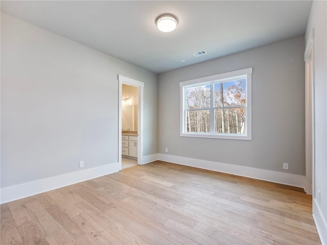 empty room featuring light hardwood / wood-style floors