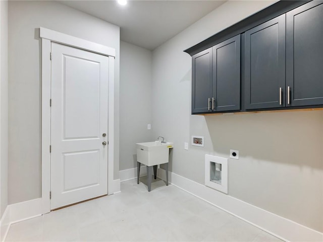 washroom featuring cabinets, hookup for a washing machine, and electric dryer hookup