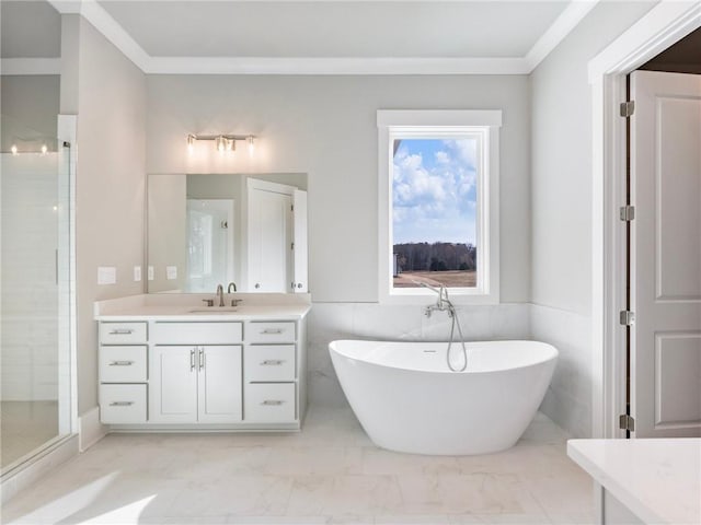 bathroom featuring vanity, ornamental molding, tile walls, and shower with separate bathtub