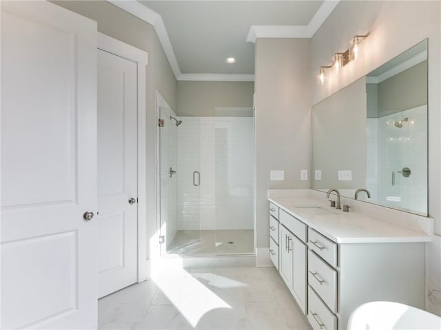 bathroom featuring vanity, an enclosed shower, and ornamental molding