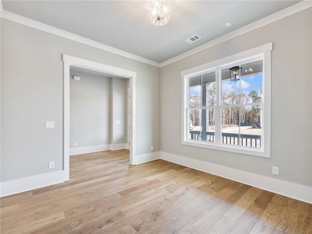 unfurnished room featuring light hardwood / wood-style floors and ornamental molding