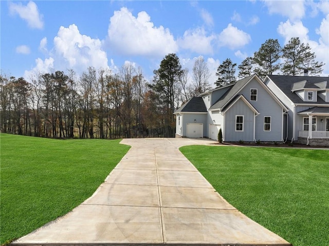 view of front of property featuring a front lawn and a garage