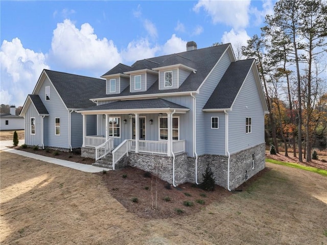 view of front of home featuring a porch and a front lawn