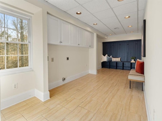 washroom with hookup for an electric dryer, cabinet space, baseboards, and recessed lighting