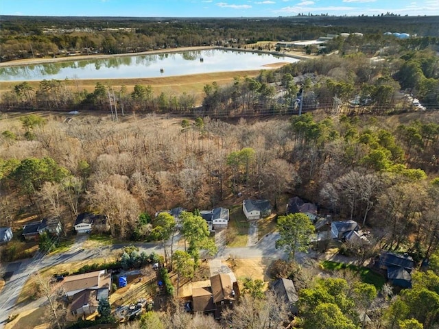 aerial view of property's location with a large body of water