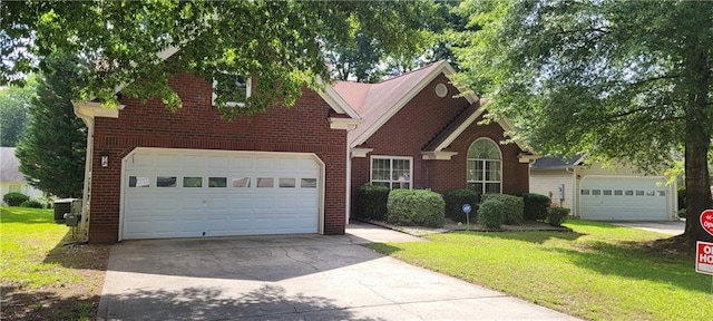 2703 Hillvale Cove Dr, Lithonia, GA 30058 - traditional-style house with driveway, brick siding, a front lawn, and central air condition unit