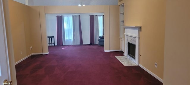 2703 Hillvale Cove Dr, Lithonia, GA 30058 - unfurnished living room featuring carpet, a fireplace, and baseboards