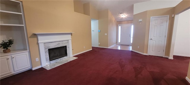 2703 Hillvale Cove Dr, Lithonia, GA 30058 - unfurnished living room with carpet, a high end fireplace, and baseboards