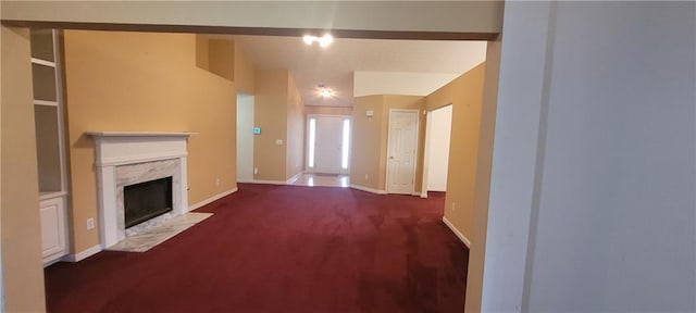 2703 Hillvale Cove Dr, Lithonia, GA 30058 - unfurnished living room with carpet flooring, a high end fireplace, and baseboards
