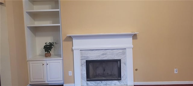 2703 Hillvale Cove Dr, Lithonia, GA 30058 - detailed view of a high end fireplace, baseboards, and built in shelves
