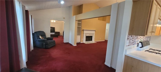 2703 Hillvale Cove Dr, Lithonia, GA 30058 - corridor with dark colored carpet, vaulted ceiling, and baseboards
