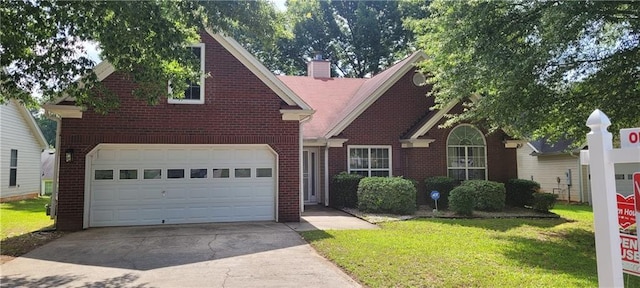 2703 Hillvale Cove Dr, Lithonia, GA 30058 - traditional-style house featuring concrete driveway, brick siding, a front lawn, and a chimney