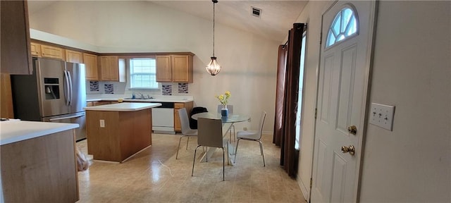 2703 Hillvale Cove Dr, Lithonia, GA 30058 - kitchen featuring stainless steel fridge with ice dispenser, dishwasher, a kitchen island, light countertops, and lofted ceiling