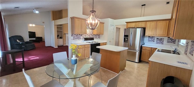 2703 Hillvale Cove Dr, Lithonia, GA 30058 - kitchen featuring range with gas stovetop, stainless steel fridge with ice dispenser, a sink, a kitchen island, and backsplash
