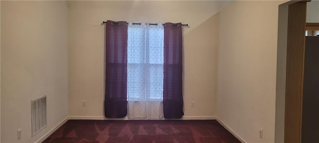 2703 Hillvale Cove Dr, Lithonia, GA 30058 - spare room featuring dark colored carpet and baseboards