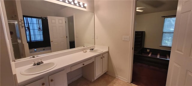 2703 Hillvale Cove Dr, Lithonia, GA 30058 - full bathroom with double vanity, a shower stall, tile patterned flooring, a garden tub, and a ceiling fan