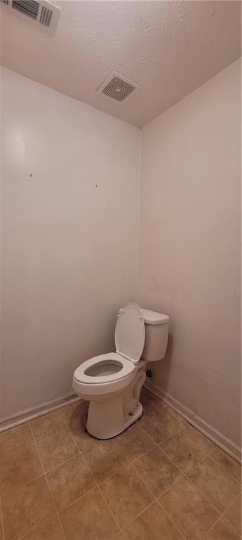 2703 Hillvale Cove Dr, Lithonia, GA 30058 - bathroom featuring toilet, baseboards, and tile patterned floors