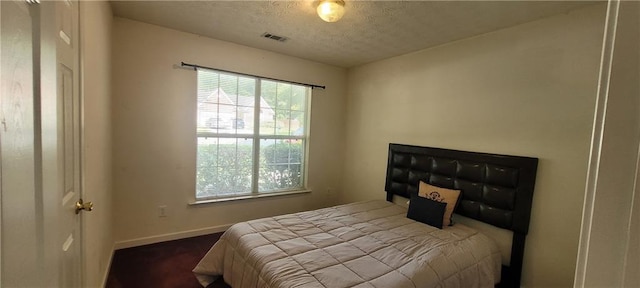 2703 Hillvale Cove Dr, Lithonia, GA 30058 - carpeted bedroom featuring baseboards and a textured ceiling