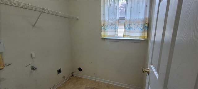 2703 Hillvale Cove Dr, Lithonia, GA 30058 - laundry area featuring electric dryer hookup and baseboards