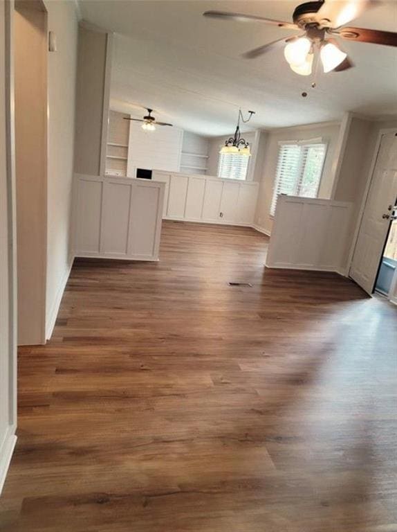 3735 Fir Dr, Buford, GA 30518 - interior space featuring baseboards, wood finished floors, and ceiling fan with notable chandelier