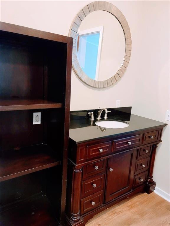 3735 Fir Dr, Buford, GA 30518 - bathroom featuring vanity and wood finished floors