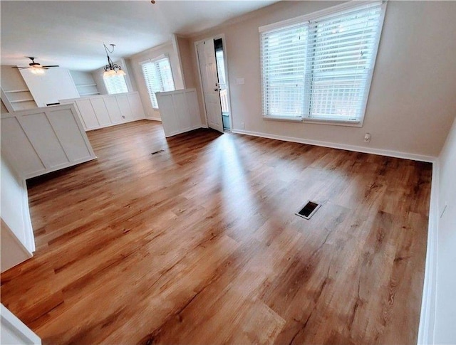 3735 Fir Dr, Buford, GA 30518 - interior space featuring wood finished floors, baseboards, a ceiling fan, and visible vents