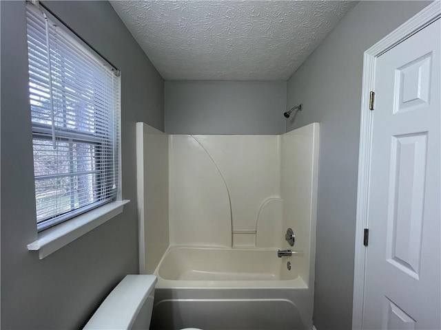 1374 To Lani Farm Rd, Stone Mountain, GA 30083 - full bath with toilet, washtub / shower combination, and a textured ceiling