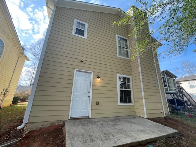 1374 To Lani Farm Rd, Stone Mountain, GA 30083 - back of property with a patio area and stairway