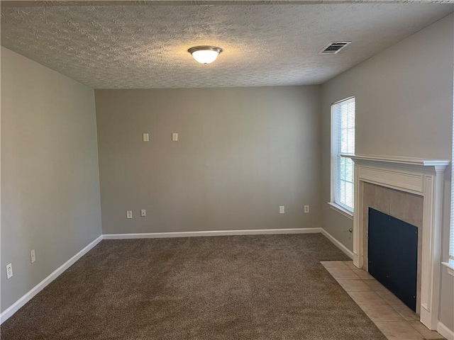 1374 To Lani Farm Rd, Stone Mountain, GA 30083 - unfurnished living room with a textured ceiling, light colored carpet, and visible vents