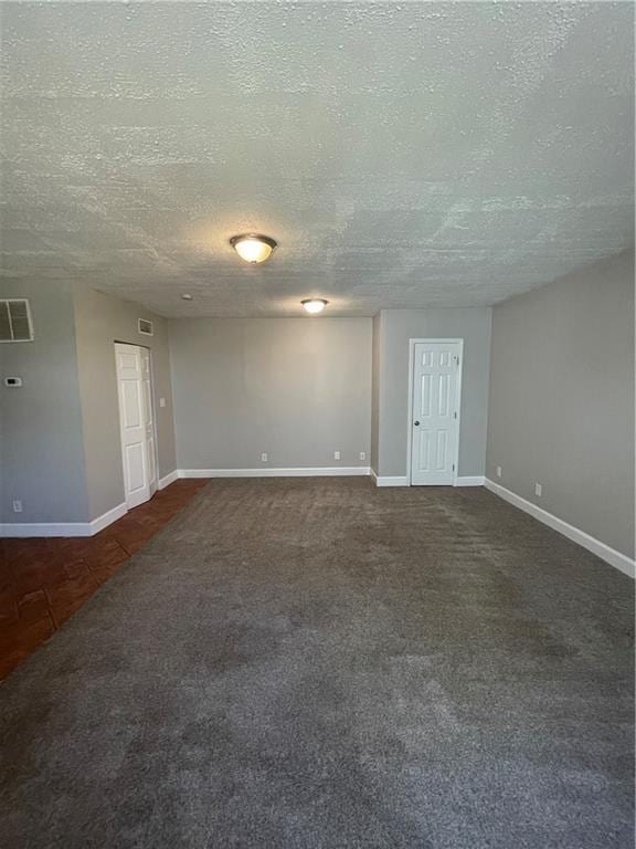 1374 To Lani Farm Rd, Stone Mountain, GA 30083 - spare room featuring baseboards, visible vents, and dark carpet