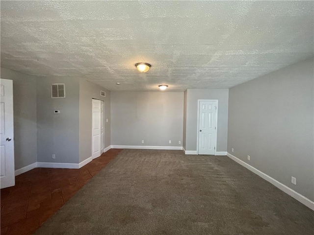 1374 To Lani Farm Rd, Stone Mountain, GA 30083 - carpeted empty room with baseboards, a textured ceiling, visible vents, and tile patterned floors