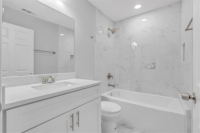 bathroom with visible vents, toilet, marble finish floor, vanity, and shower / washtub combination