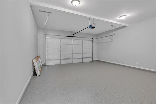 garage with baseboards and a garage door opener